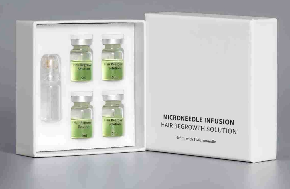 Open white box containing four 5ml vials of hair regrowth solution and one micro-infusion applicator, beside the closed box lid