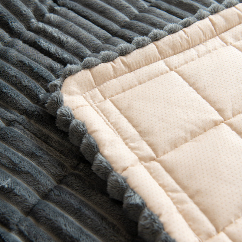 Underside of the sofa cover showing the dotted non-slip grip backing