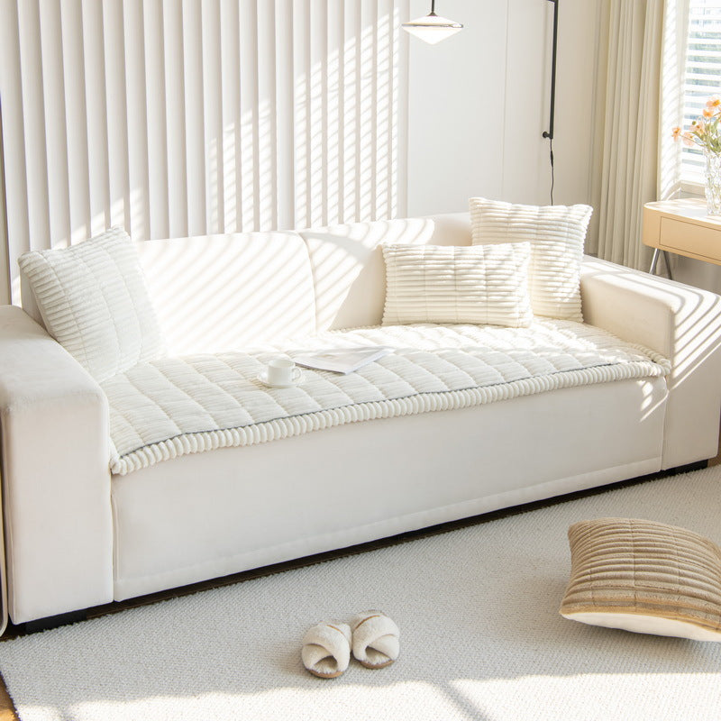 Thriv chenille sofa cover in cream on a light sofa